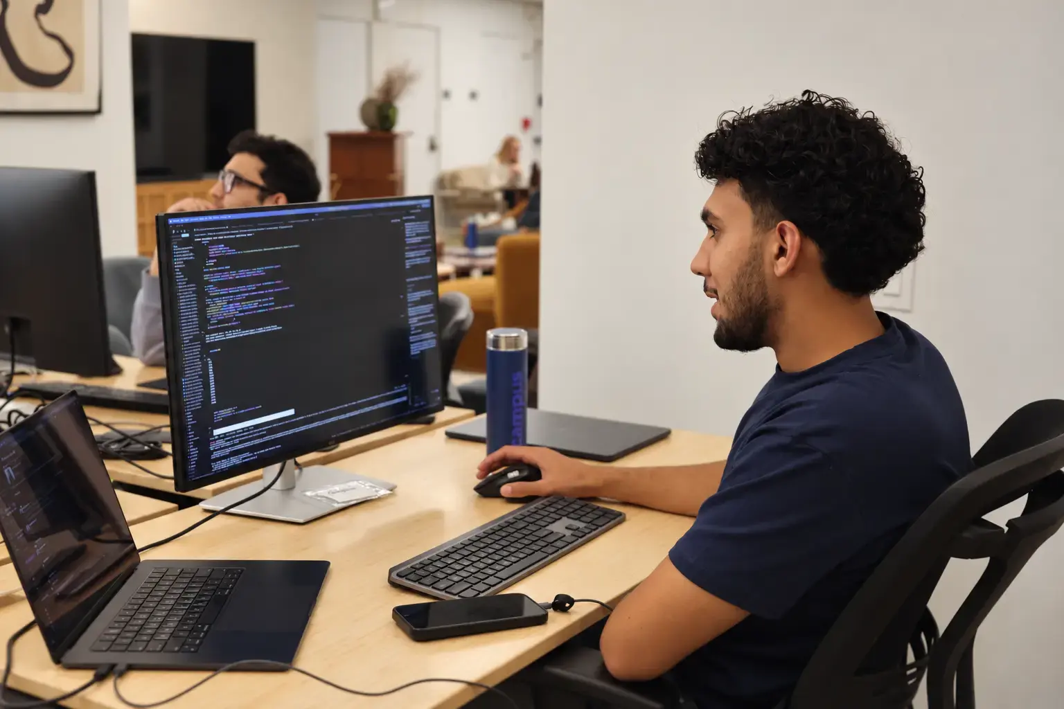 Cybersecurity student working at a computer