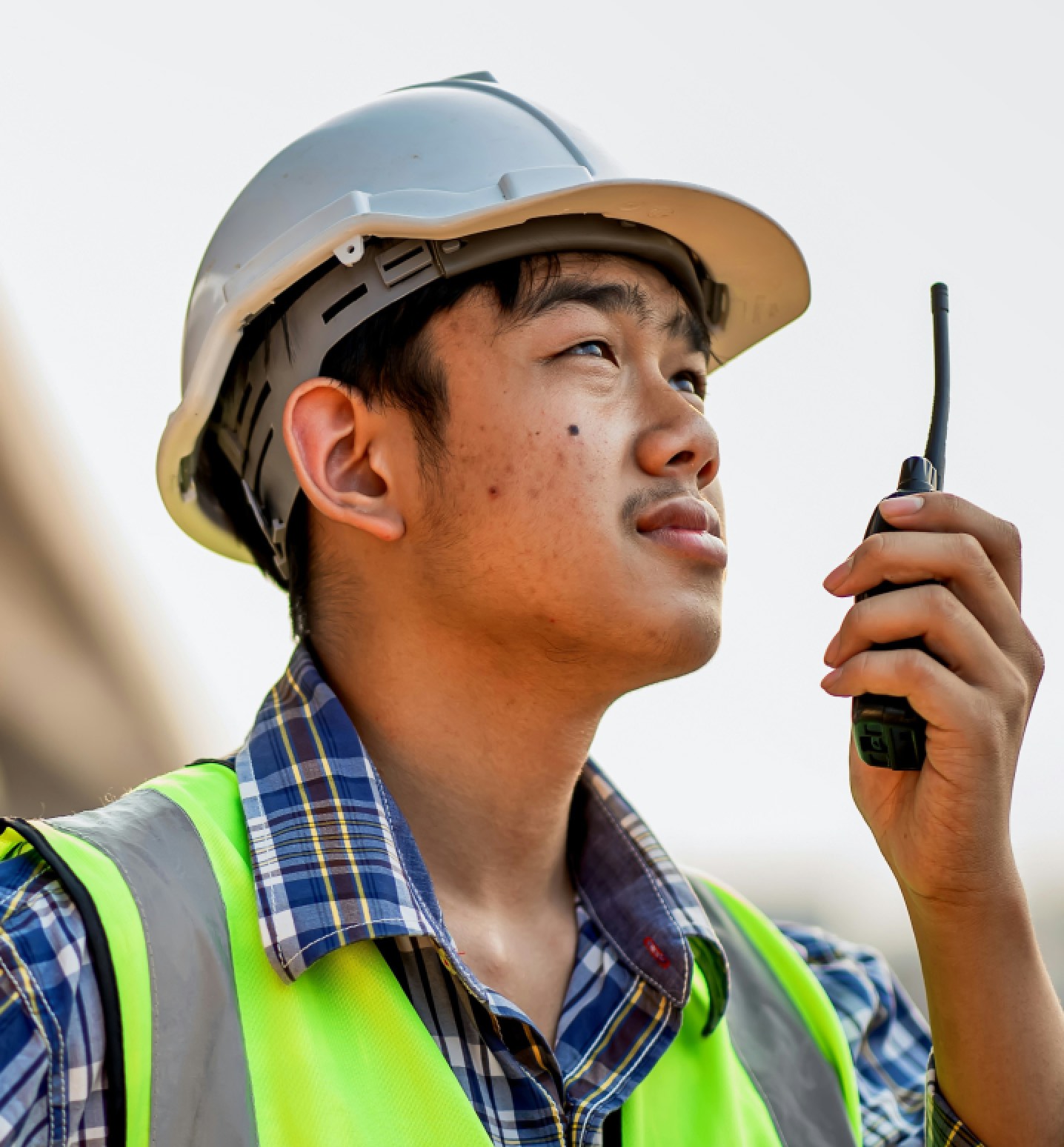 WorkWhile professional using a radio